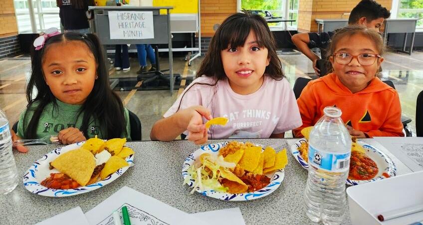 Students enjoy eating at the Hispanic Heritage Month Fiesta